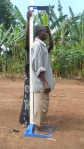 Data collection, measuring someone's height on uneven ground. credit: Georgina Murphy